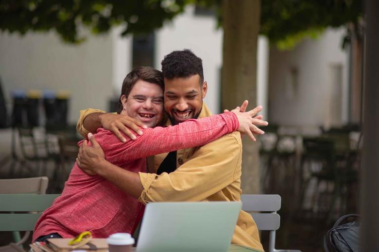 two people hugging 